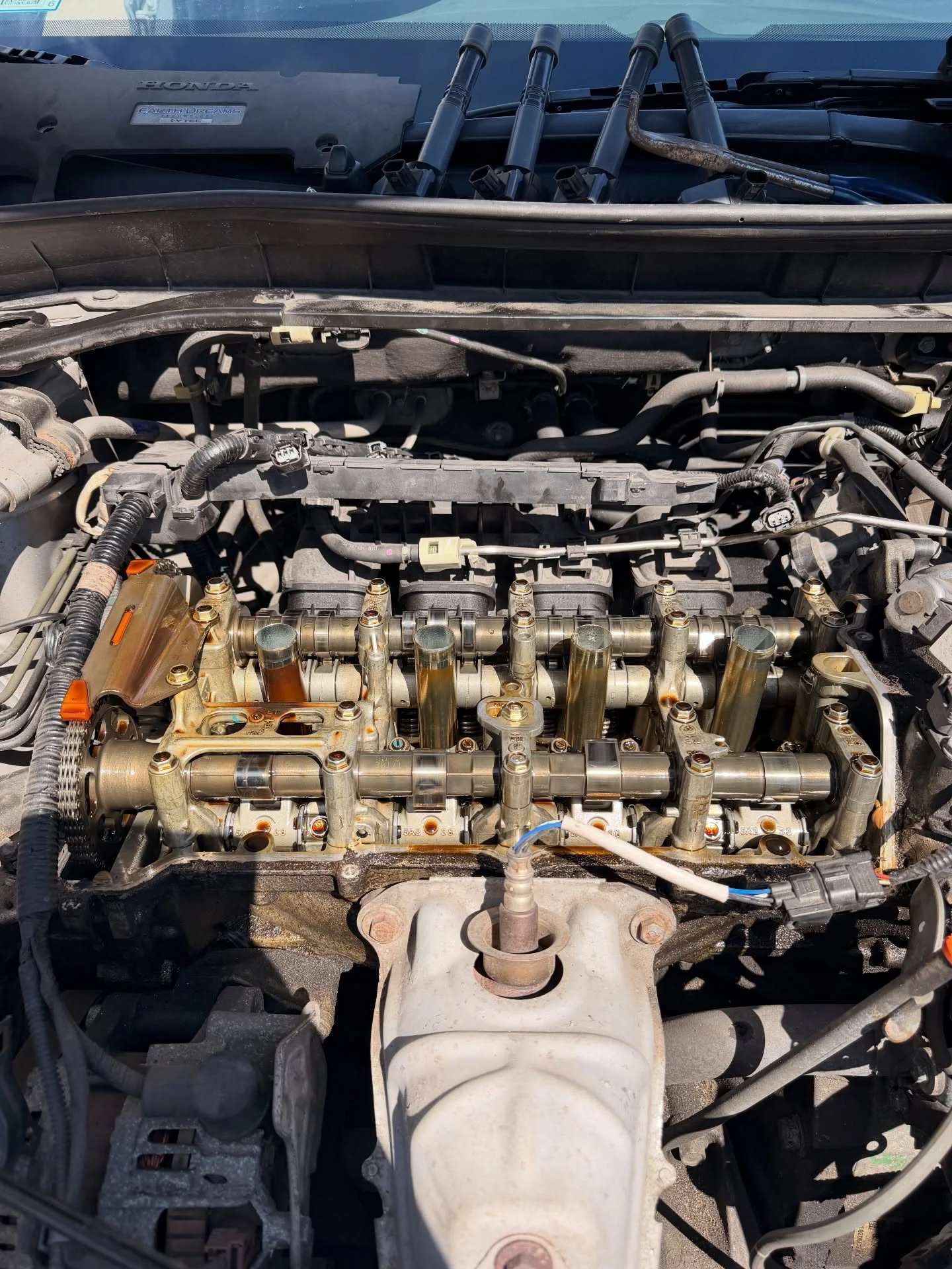 Honda Accord engine with the valve cover removed for gasket service