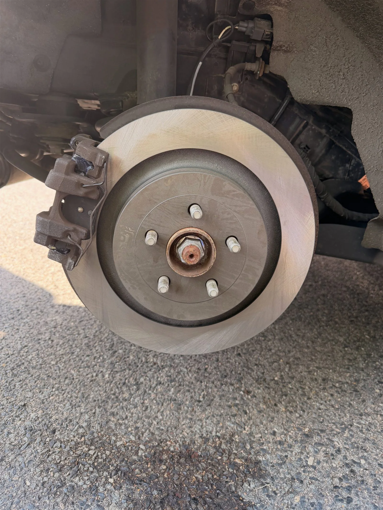New rear brake rotor installed on a 2022 Lincoln Nautilus
